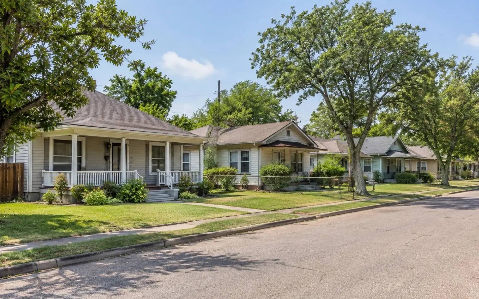 Older single-story homes on a residential street in Pasadena, TX